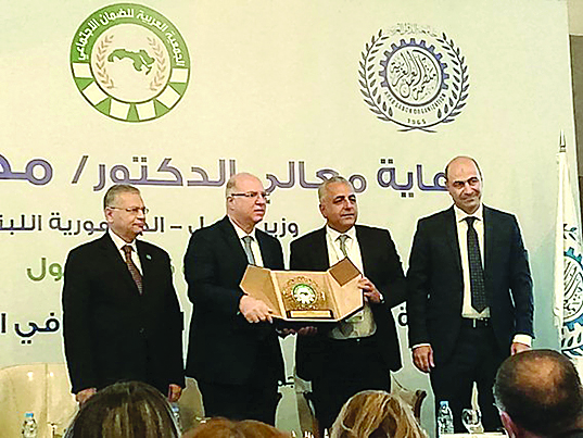 حيدر يفتتح ندوة الضمان وكركي يطالب بوضع استراتيجيات وطنيّة للانتقال إلى العمل المنظّم